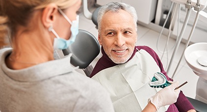 Man in dental chair making impressions for dentures