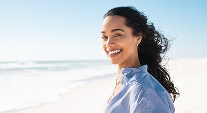 Lady smiles on beach?