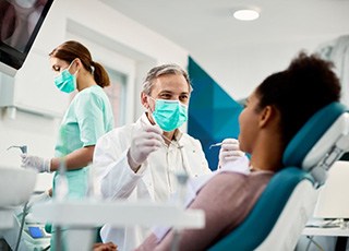 Dentist treats patient