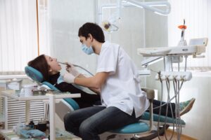 Woman in dentist’s chair for treatment